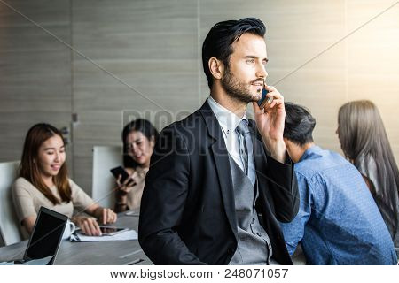 Businessman Using Smartphone For Talking With Business Plan At Team Meeting, Businrss With Meeting C