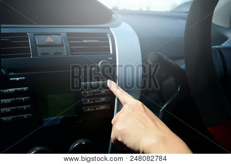 The Index Finger Of Women Press On The Button At The Control Panel For Play Music In Car