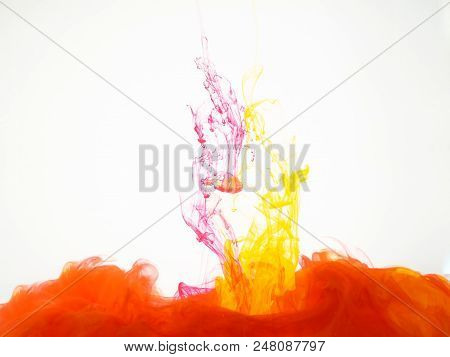 Colourful Explosion Of Acrylic Ink Isolated On White Background. Cloud Of Silky Ink In Liquid, An Ab