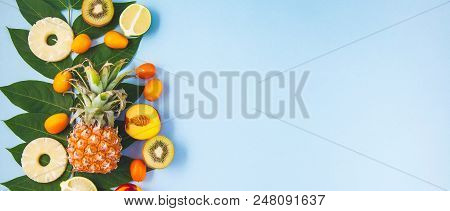 Morning Breakfast, Fruit, Peaches, Pineapple, Kiwi, Lime On A Blue Background With Green Leaves Heal