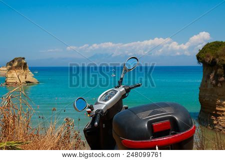 A Generic White Scooter Bike Is Parked At The Seaside Of The Island Of Sal, Cape Verde. The Tropical