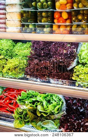 Colourful Mix Of Different Red, Orange, Yellow, Green Fresh And Canned Vegetables And Greens At The 