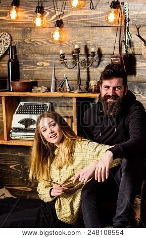 Family Spend Pleasant Evening With Books, Interior Background. Girl And Man On Happy Faces Reading B