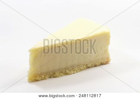 One Piece Of The Yummy Cheesecake Isolated On A White Background.