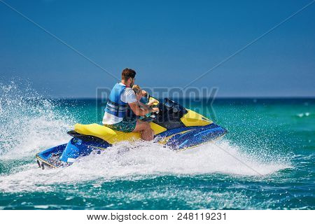 Happy, Excited Family, Father And Son Having Fun On Jet Ski At Summer Vacation