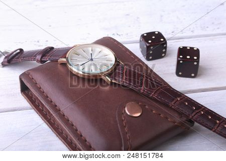 Men's Accessories For Business And Rekreation. Watch, Leather Wallet And Dice On Wood Background.. T