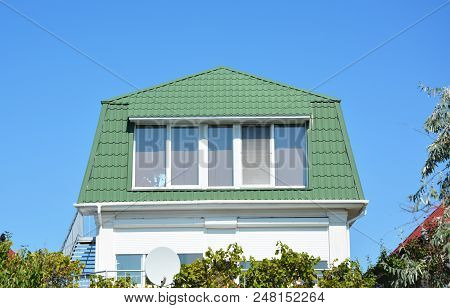 Cozy House With Beautiful Attic Mansard Room, Big Windows, And Green Metal Roof.