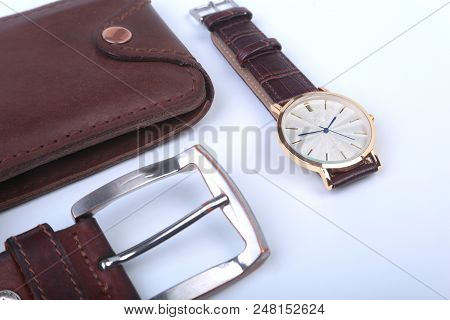 Men's Accessories For Business And Rekreation. Leather Belt, Wallet, Watch And Smoking Pipe On White