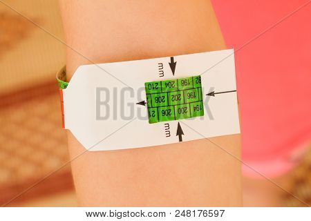 Measuring Malnutrition Using Strap Muac Mid-upper-arm-circumference.the Hand Of A Healthy Well-fed C