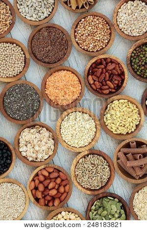 Dried macrobiotic super food  with legumes, seeds, nuts, cereal, grains, vegetables & whole wheat pasta with foods high in protein, omega 3, anthocyanins, antioxidants, minerals &  vitamins. Top View.