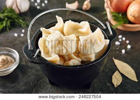 Dumplings Jiaozi, Dimsum, Momo or Ha Gao on Dark Background. Asian Food of Dough Based on Flour Stuffed with Meat, Fish, Vegetables, or Sweets