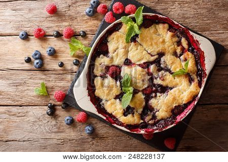 Summer Berry Cake With Raspberry Berries, Currants And Blueberries Close-up In A Baking Dish. Horizo