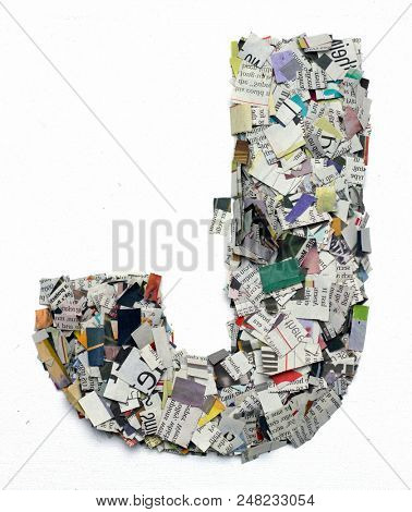 Letters made from newspaper capitel J isolated on white 