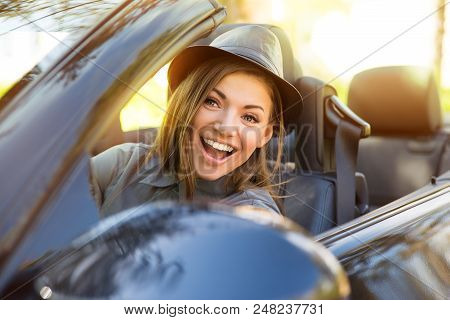 Shot Of A Young Cute Woman Enjoying A Drive In A Convertible Loving The Breeze In Her Face