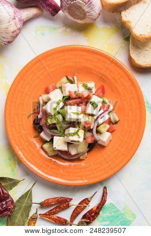 Greek salad with feta cheese cubes and fresk vegetables