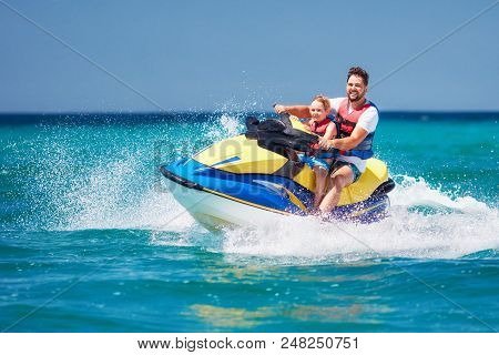 Happy, Excited Family, Father And Son Having Fun On Jet Ski At Summer Vacation