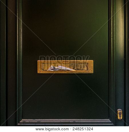 Green Vintage Door With Golden Postbox, Letters And Newspapers In Mailbox. Concept: News, Get News