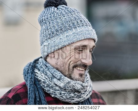 Guy In Winter Warm Hat And Scarf. Portrait Of Smiling Man On Street. Men In Knitted Scarf, Hat And R