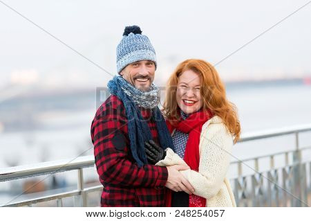 Middle Age Man And Women Smiling On Street. Joyful Women And Guy. Smiling Couple On Street In Winter