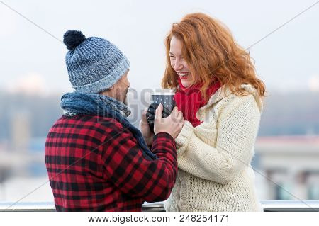 Guy Gives Cup Of Coffee To Woman On Street. Urban Life Of Urban People. Woman Likes Hot Drinks. Midd