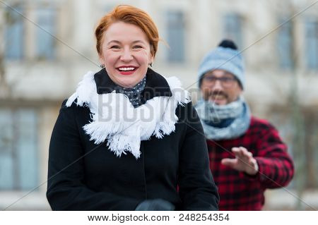 Happy Woman Gone From Man In Glasses. Smiling Woman Go Away From Man. Guy Catching Up Happy Woman On