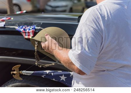 Veteran With Us Flag And Wwi Helmet On Parade