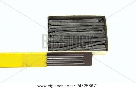 Carbon Drawing Supplies. Graphite Woodless Monolith Pencils And Natural Charcoal Sticks. Isolated Ba