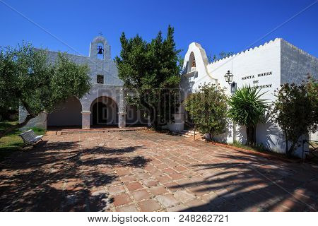 Cambrils, Spain - June 20, 2018. Shaded Courtyard Of The Church Of Santa Maria De Vilafortuny. Distr