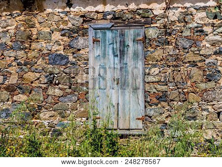 Omodos, Cyprus. May 2018. A Typical View Of An Old Building With Old Doors In The Traditional Villag