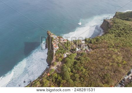 Aerial drone view of temple and beautiful Uluwatu clffs in Bali, Indonesia