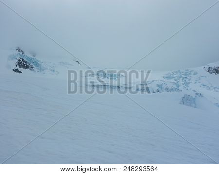 Crevasses And Seracs On A Glacier