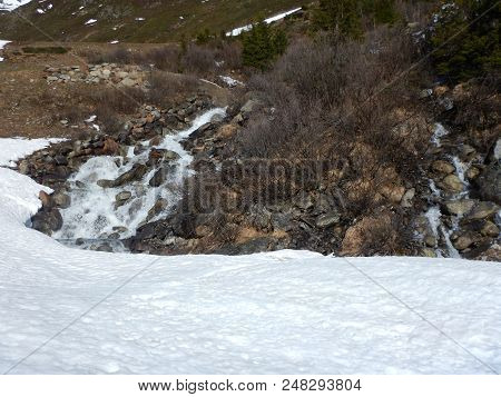 Waterfall On An Alpine Stream