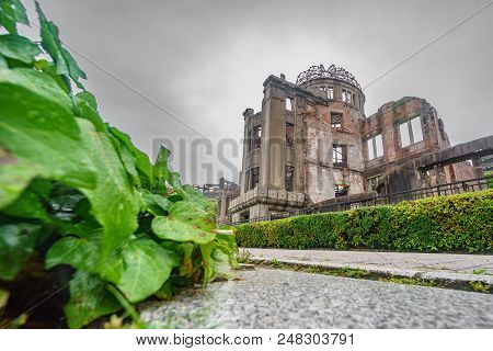 Wide Angle Bottom View Of Hiroshima Bomb Dome, Road And Plants, Japan