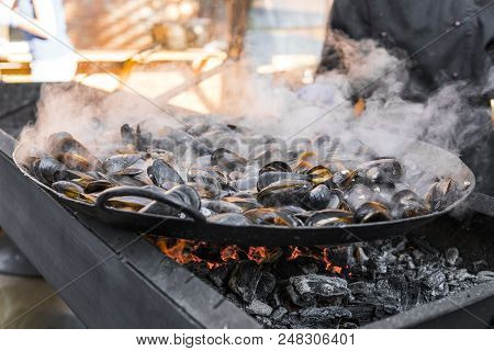 Fresh Mussels At Grill Pan. Seafood Barbecue Outdoors. Picnic Healthy Food, Mussels In Shells. Plent