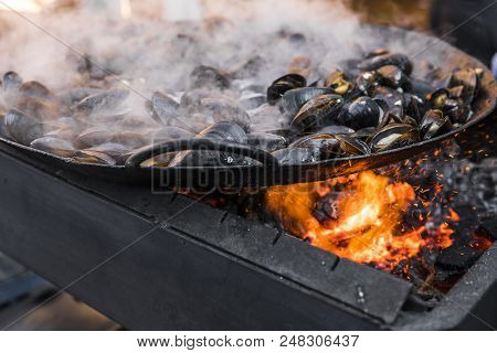 Fresh Mussels At Grill Pan. Seafood Barbecue Outdoors. Picnic Healthy Food, Mussels In Shells. Plent