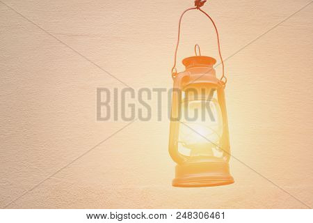 Old Kerosene Lamp On The Background Walls. Space For Text
