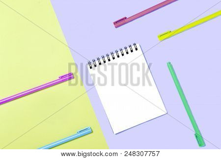 Empty Notebook Or Notepad On Violet And Yellow Background. Creative Minimalism Chancery Concept. Top