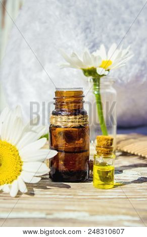 Chamomile Essential Oil. Selective Focus. Butle Little.