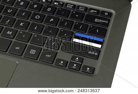 Flag Of Estonia On Laptop Keyboard, Close-up.