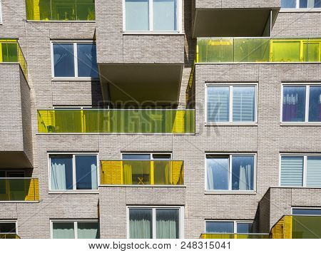 Amsterdam, Netherlands - June 20, 2018: Apartments With Yellow Balconies At The Zuidas On The  Benja