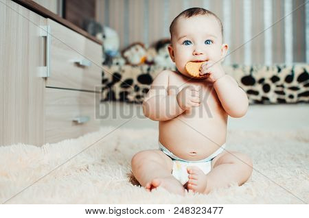 Adorable Baby Eating A Cookie