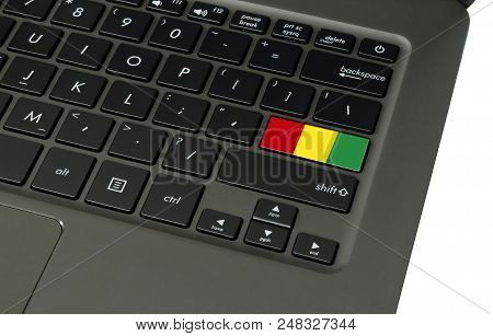 Flag Of Guinea On Laptop Keyboard, Close-up.
