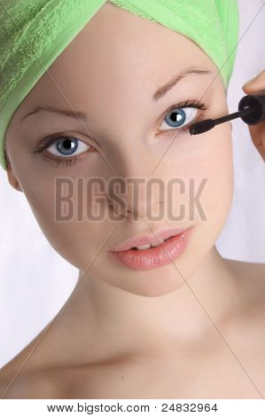 Girl in the towel doing make-up