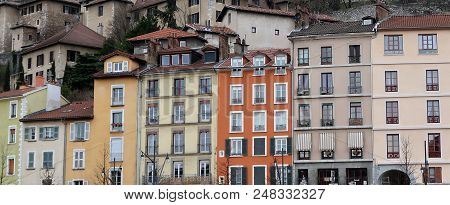 Buildings Of Different Shapes And Colors Along The Isère River In Grenoble, France