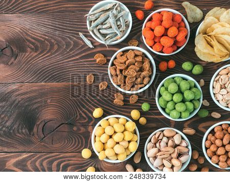 Assortment Of Different Snack For Beer, Wine, Party. Peanuts In Coconut Glaze, Green Vasabi, Red Spi