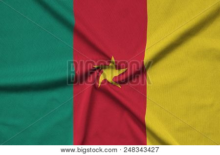 Cameroon Flag  Is Depicted On A Sports Cloth Fabric With Many Folds. Sport Team Waving Banner