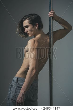 Young Strong Pole Dance Man In Grey Sudio