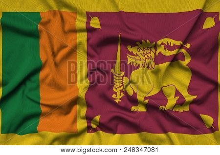 Sri Lanka Flag  Is Depicted On A Sports Cloth Fabric With Many Folds. Sport Team Waving Banner