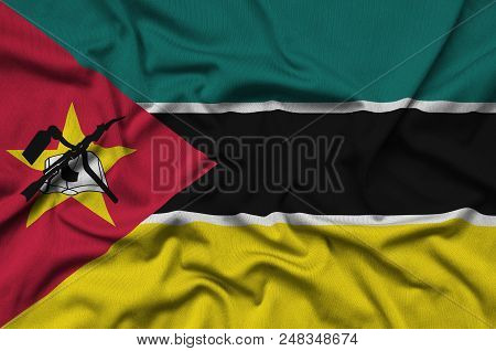 Mozambique Flag  Is Depicted On A Sports Cloth Fabric With Many Folds. Sport Team Waving Banner