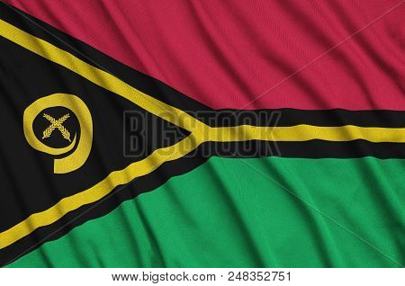 Vanuatu Flag  Is Depicted On A Sports Cloth Fabric With Many Folds. Sport Team Waving Banner
